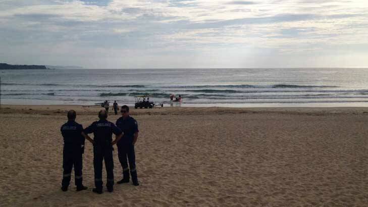 Searchers at the scene of a suspected shark attack at Tathra.