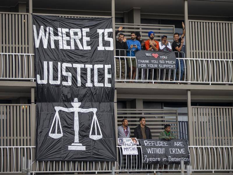 Queensland Police want protesters to abandon a sit-in for asylum seekers detained in Brisbane.