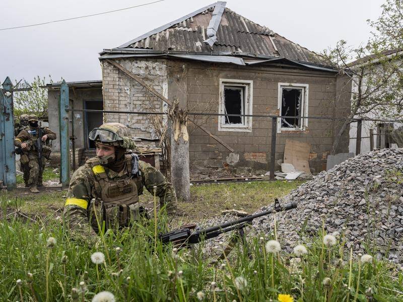 Ukrainian National Guard patrol a retaken village on the outskirts of Kharkiv.