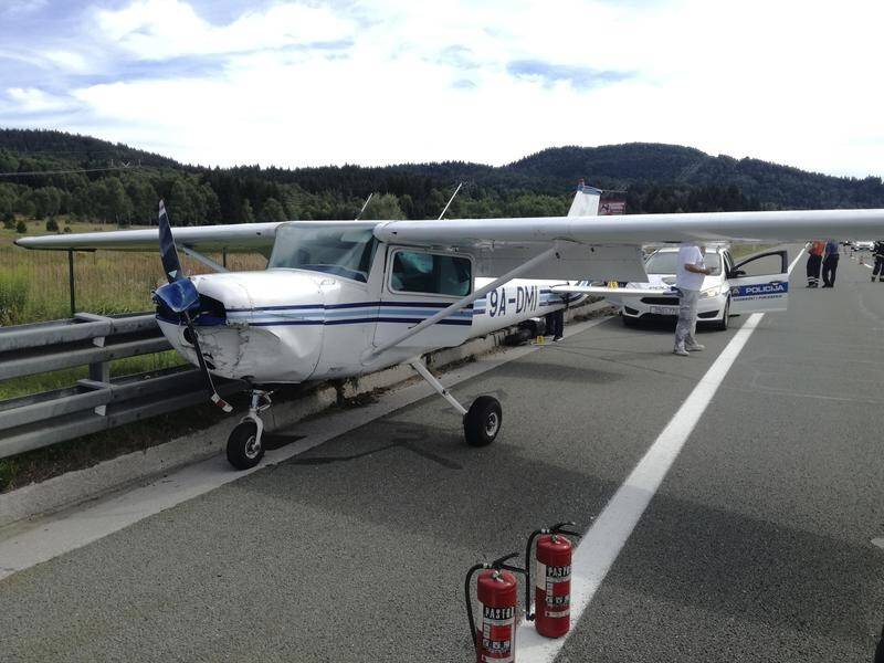 A pilot brought his small plane down safely on a bsuy highway in Croatia after the engine failed.