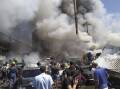 The blast and fire at the Surmalu market sent a towering cloud of smoke over Yerevan. (AP PHOTO)