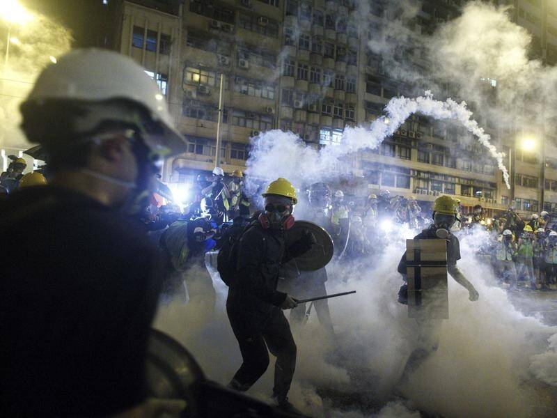 Riot police fired tear gas as thousands of protesters targeted China's Liaison Office in Hong Kong.