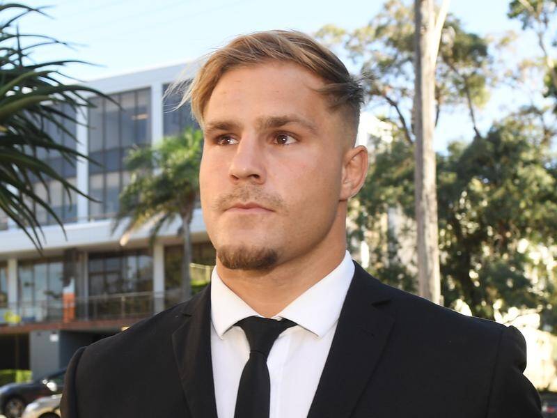 NRL player Jack de Belin has pleaded not guilty to raping a woman with a friend.