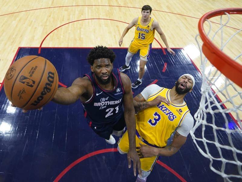 Joel Embiid had a 30-point triple-double in Philadelphia's thumping NBA win over the LA Lakers. (AP PHOTO)