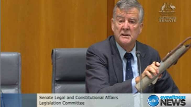Senator Bill Heffernan brandishes a mock-up pipe bomb to highlight cuts in security screening at Parliament House. Photo: Courtesy Channel 10