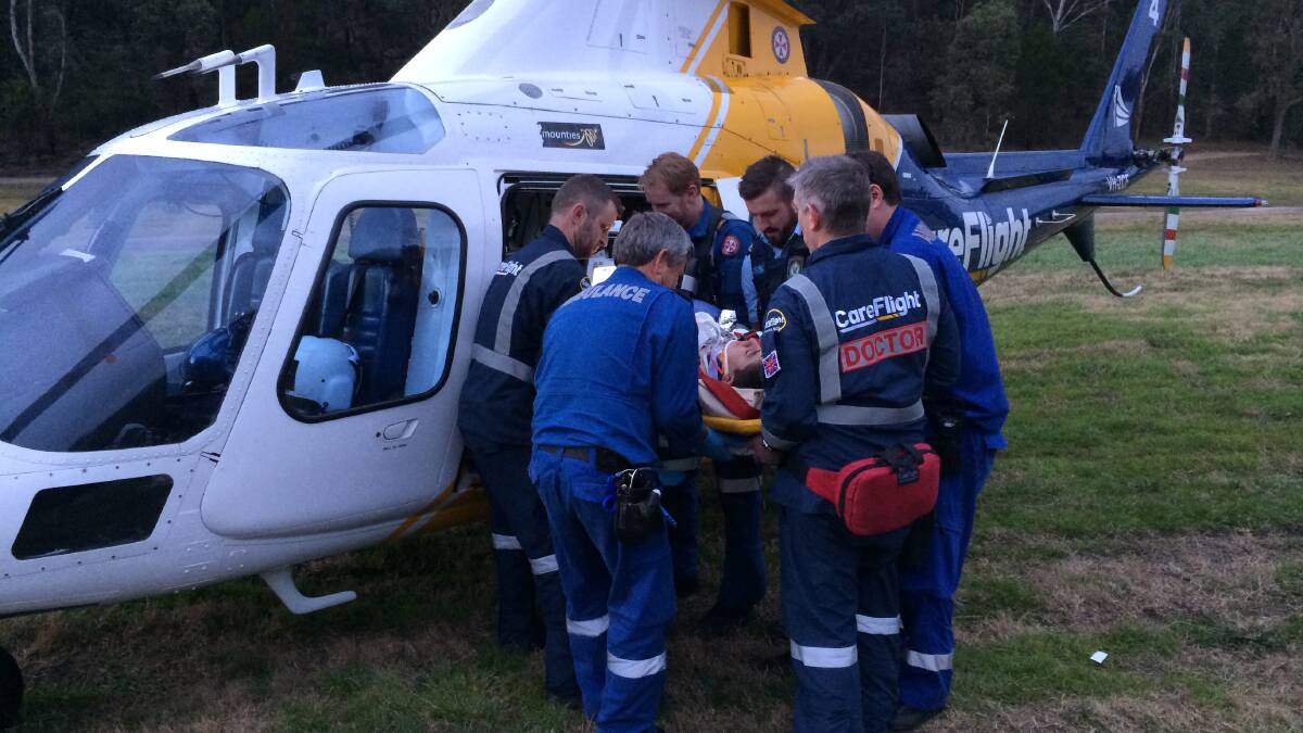 The teenager being lifted into the helicopter at Pacific Park South Maroota.