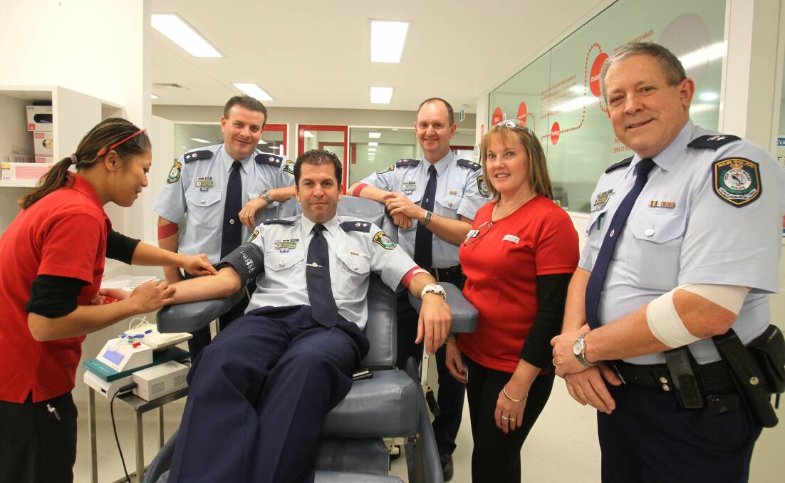 Blue Mountains Commander Darryl Jobson, Hawkesbury LAC Commander Steve Egginton, Penrith LAC Commander Brett McFadden and St Marys LAC Commander Greg Peters with registered nurse Jessica Chou (at left) and enrolled nurse Shaynie Leonard for the Emergency Services Blood Challenge. Picture: Gene Ramirez