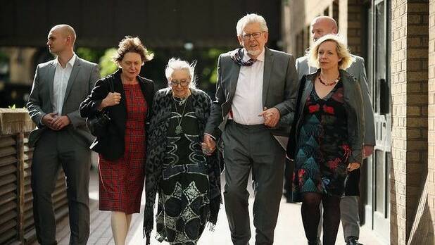 Rolf Harris leaves Southwark Crown Court with his wife Alwen Hughes (his right) and daughter Bindi (his left). Photo: Getty Images