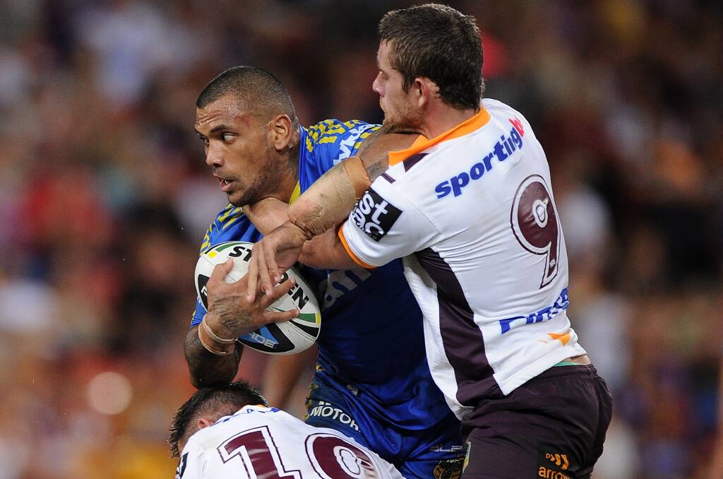 BRISBANE, AUSTRALIA - APRIL 04: Manu Ma'u of the Eels is tackled during the round five NRL match between the Brisbane Broncos and Parramatta Eels at Suncorp Stadium on April 4, 2014 in Brisbane, Australia. (Photo by Matt Roberts/Getty Images)