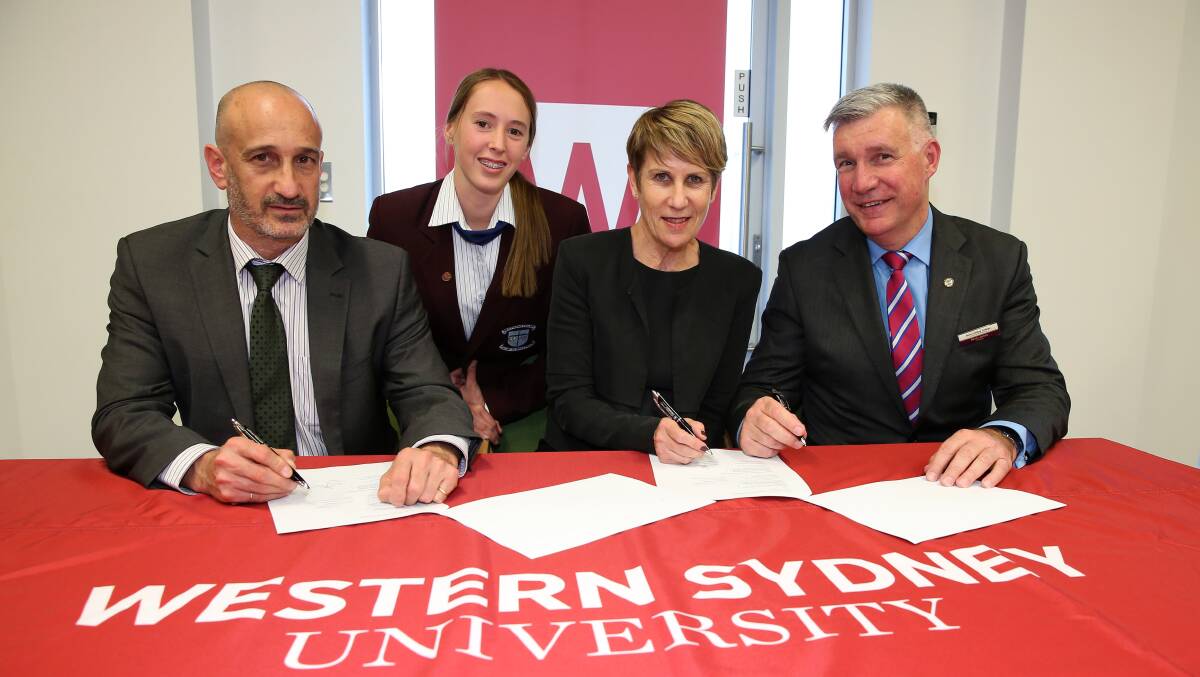 New pathway for agriculture students: WSU’s Professor Gregory Kolt, Bede Polding College student Emily Jones, Deputy Vice-Chancellor Denise Kirkpatrick and principal Kevin Jones at the signing of the new memorandum with agricultural schools. Picture: Geoff Jones