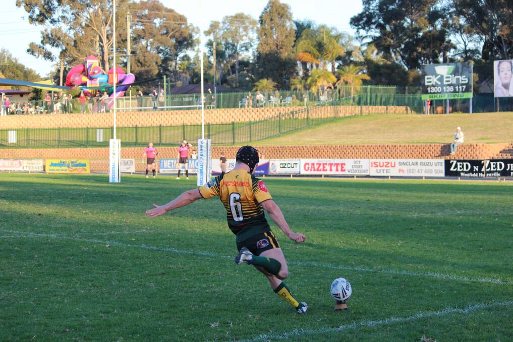 Windsor Wolves five-eighth Aaron Farkas kicks a goal against Blacktown Workers. Picture: Conor Hickey