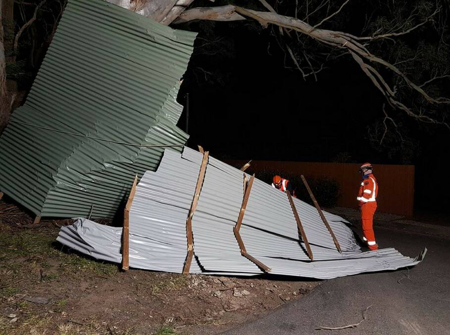 STORM SEASON: Haweksbury SES attending a call out after a roof of a stable was ripped off and blown across Bells Line of Road, Kurmond, impacting houses in Inverary Drive following wild winds in August.