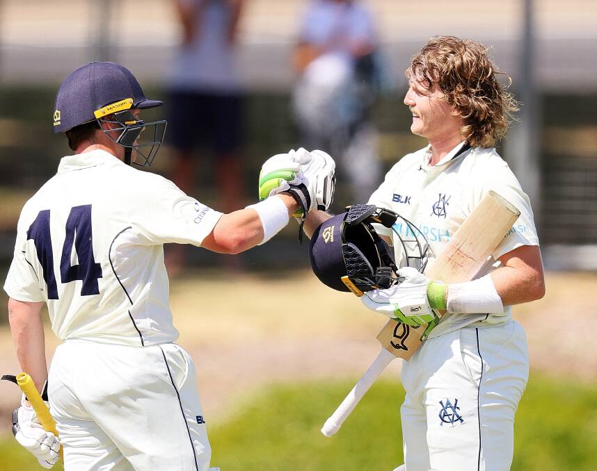 CALL UP: Will Pucovski, of Victoria, is congratulated by teammate Marcus Harris after reaching his Sheffield Shield century. Photo: Daniel Kalisz/Getty Images