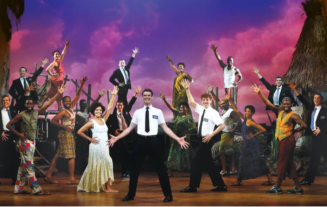 BOOK OF MORMON: Loredo Malcolm (up-stage left) is a Ugandan villager in the long-running hit still at the Sydney Lyric Theatre after two years.