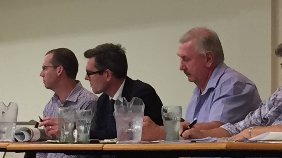 LISTENING: Roads and Maritime Services' Colin Langford, Member for Hawkesbury Dominic Perrottet and Pitt Town Progress Association's Peter Ryan listen to a speaker at the Pitt Town Progress Association meeting on December 7. Picture: Conor Hickey