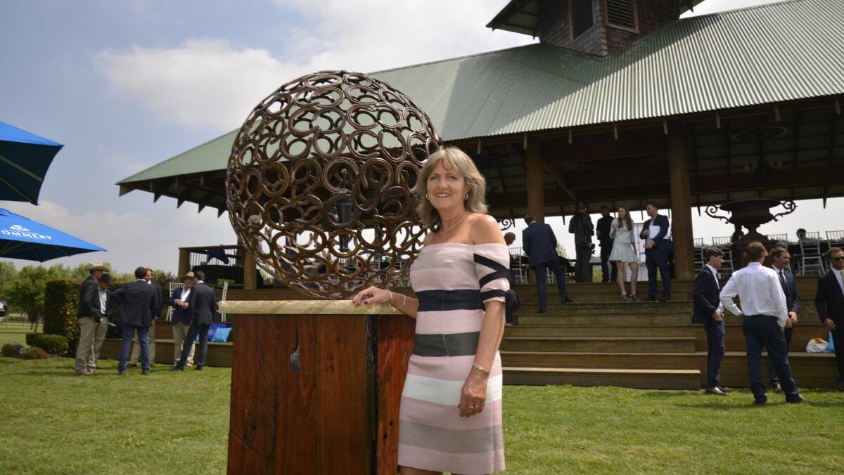 Selena Hitches poses with her sculpture at the launch of the World Polo Championship. Picture: Conor Hickey