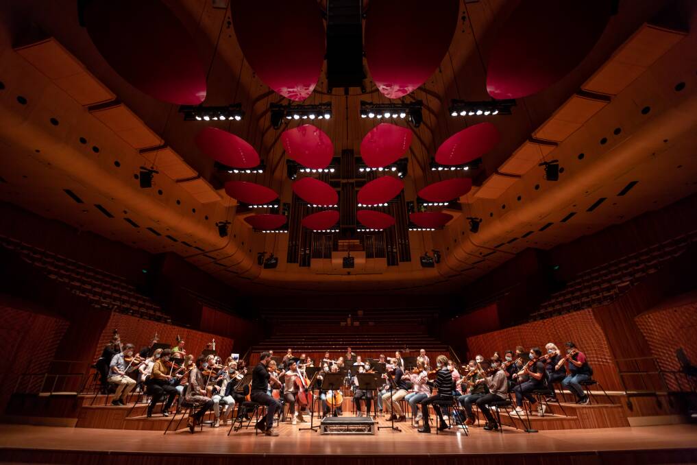 Musicians during acoustic testing in the Sydney Opera House Concert Hall ahead of its official opening.Picture: Daniel Boud