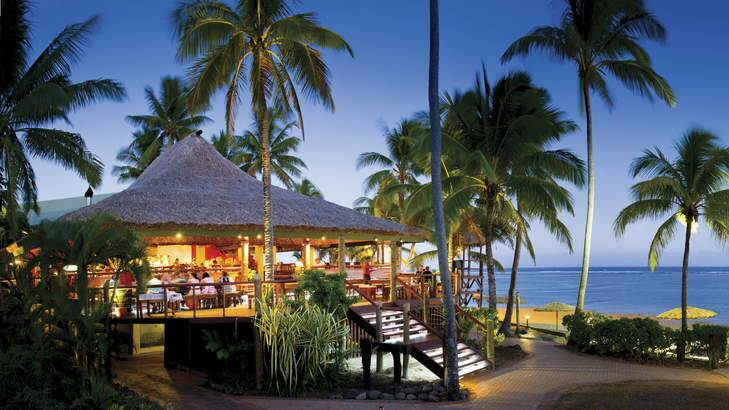Island paradise ... guests soak up the sunset ambience at Sundowner Bar & Grill, Outrigger on the Lagoon.