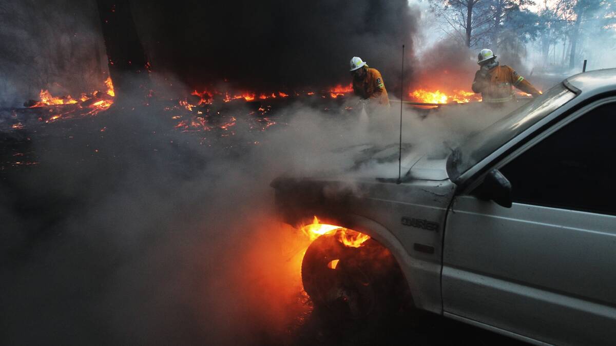 Fire destroyed vehicles in Londonderry in western Sydney. Photo: NICK MOIR