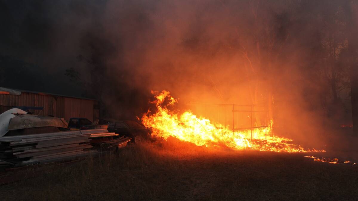 Fire destroyed vehicles in Londonderry in western Sydney. Photo: NICK MOIR