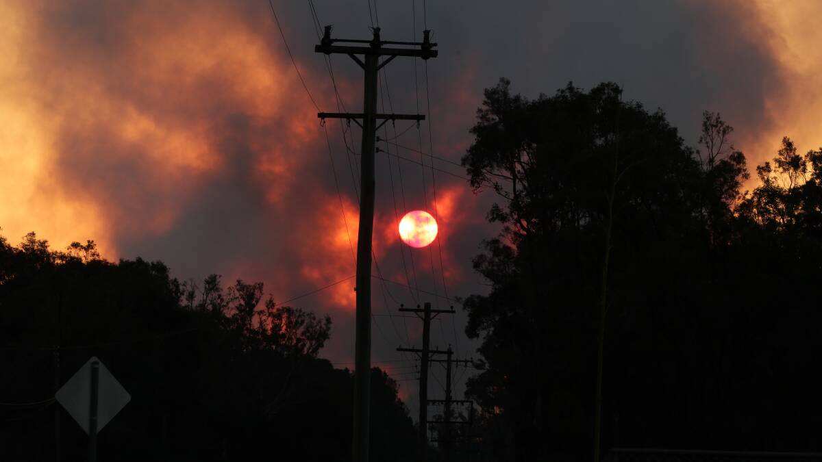 Smoke colours the sky in western Sydney. Photo: DALLAS KILPONEN