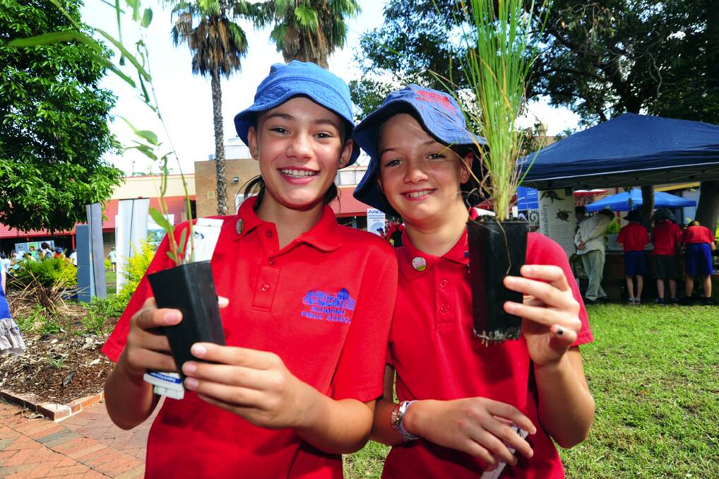 Aimee Dibley and Piper Lord of Richmond PS with some seedlings. Photo: Kylie Pitt.