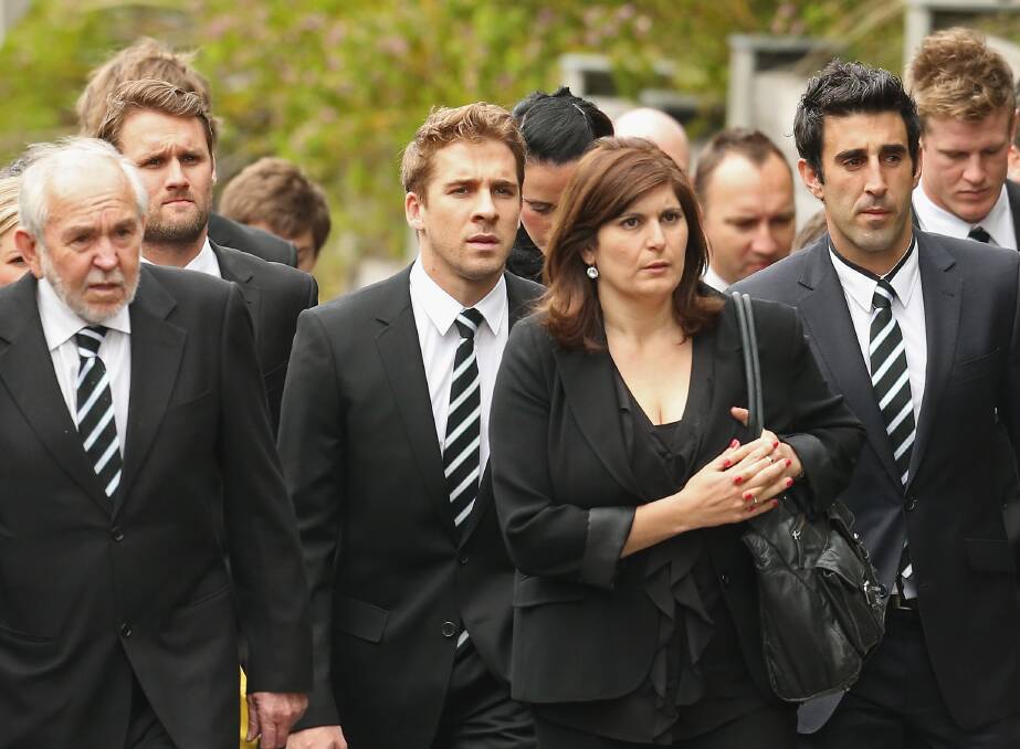 Australian actor Hugh Sheridan arrives along with Domenic Cassisi and players and staff from Port Adelaide to attend the funeral service for John McCarthy at St Mary's Star of the Sea Catholic Church on September 20, 2012 in Sorrento, Australia. Port Adelaide AFL player John McCarthy died at the Flamingo Hotel and Casino in Las Vegas during a player end of season holiday. (Photo by Scott Barbour/Getty Images)