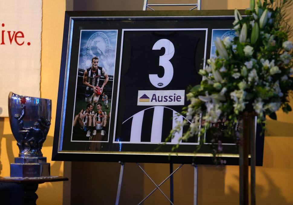 A Collingwood Magpies gurnsey and photos are displayed in the church prior to the funeral service for AFL Footballer John McCarthy, at St Mary's Star of the Sea Catholic Church, on September 20, 2012 in Sorrento, Australia. Port Adelaide AFL player John McCarthy died at the Flamingo Hotel and Casino in Las Vegas during a player end of season holiday. (Photo by Sean Garnsworthy-Pool/Getty Images) 